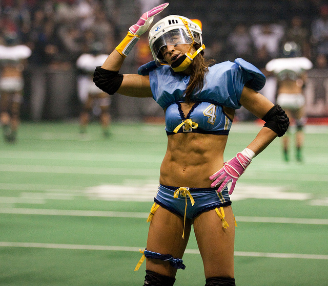 female football athlete with six pack abs