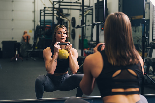 woman doing kettlebell goblet squats