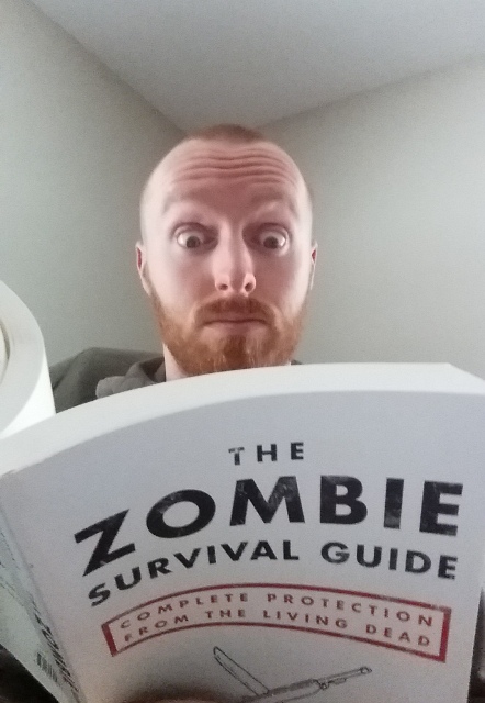 john reading book about the zombie apocalypse