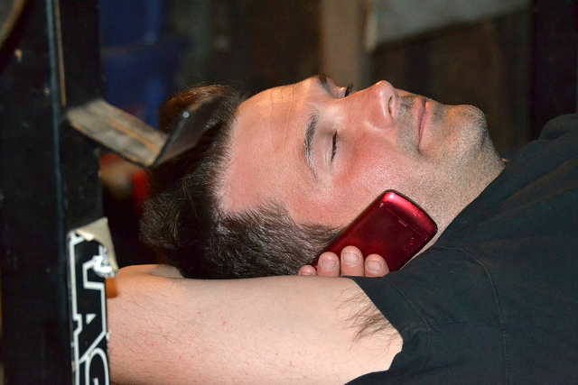 man at gym with cell phone