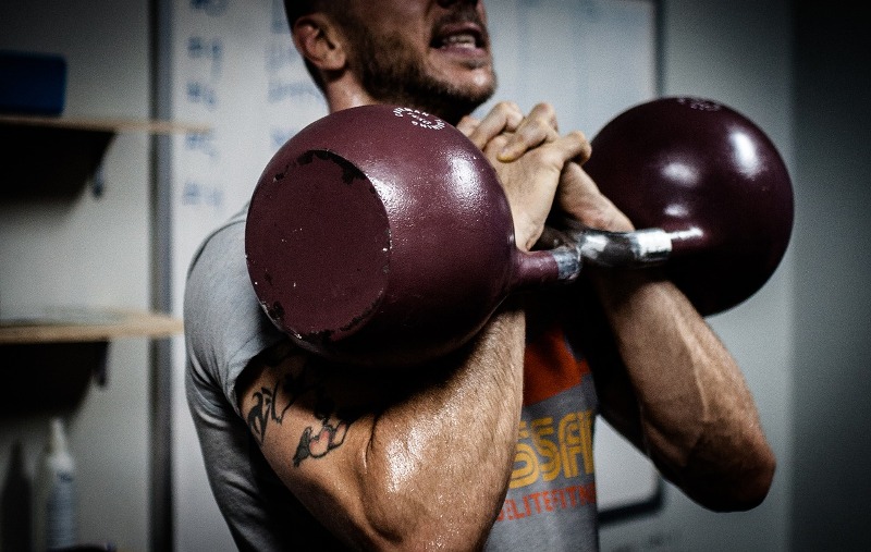 kettlebells in rack position