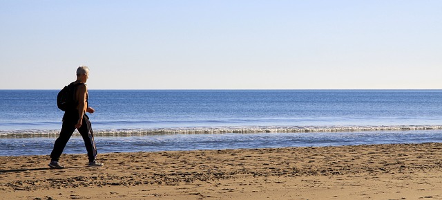 man rucking at beach