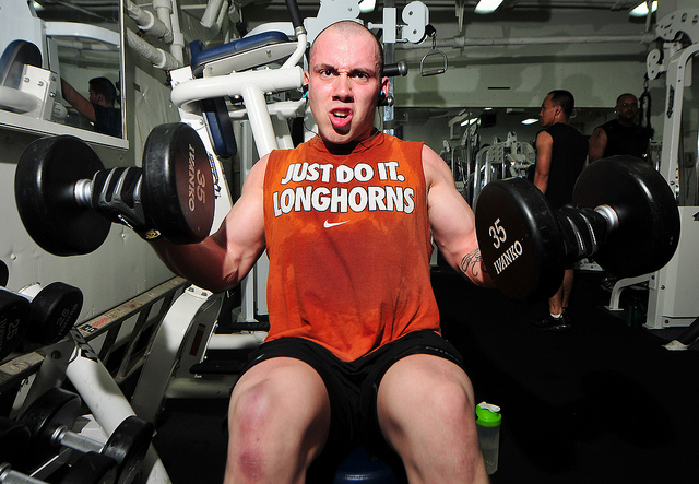 male seated dumbbell curls