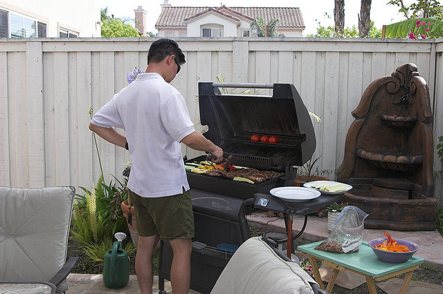 man cooking at bbq