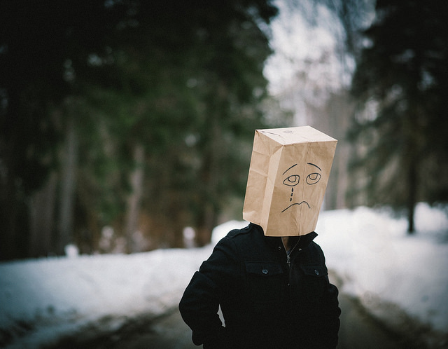 man with bag over head