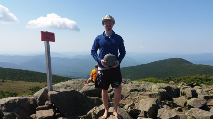 john atop mt moosilauke with stone in hand